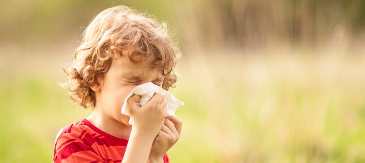 Sneezing kid stock photo